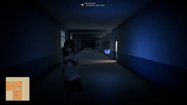 A dark corridor with a blue light at its end